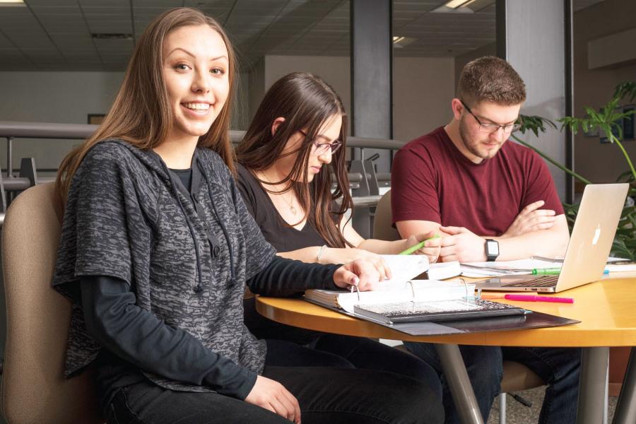 Students gathered at table discussing